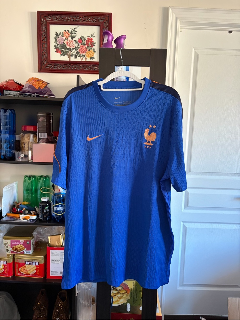 Nike Men’s Blue France Football Jersey with Orange Accents